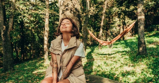 A woman relaxing in a forest