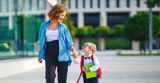 A mother walking her young son to school