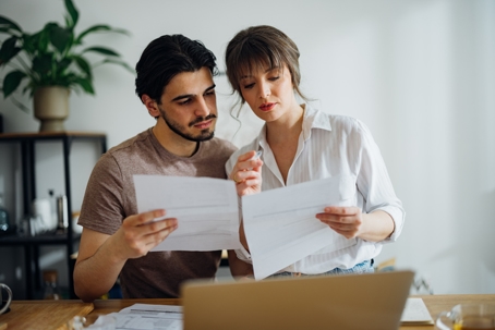 couple going over documents at home