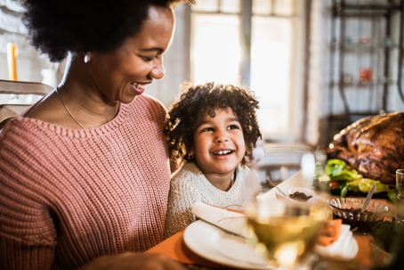 mother and child at the Thanksgiving table