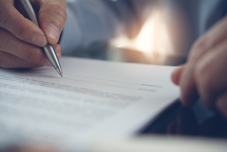 person signing a document