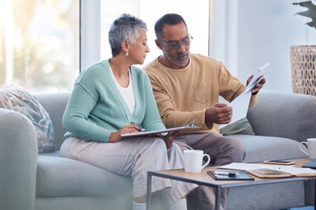couple reviewing documents at home