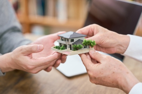 Asian family inheriting real estate from parents to children